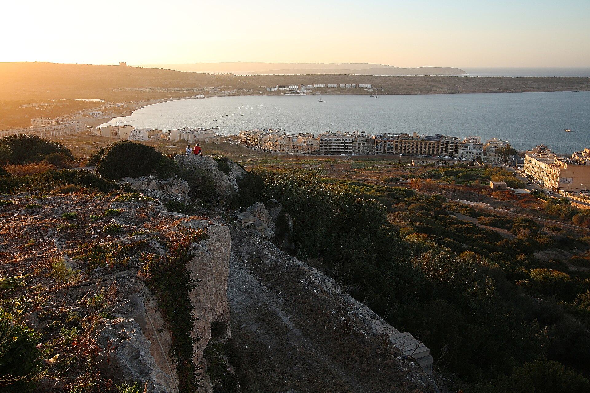 The long sandy sweep of Mellieħa Bay seen from the hillside above it