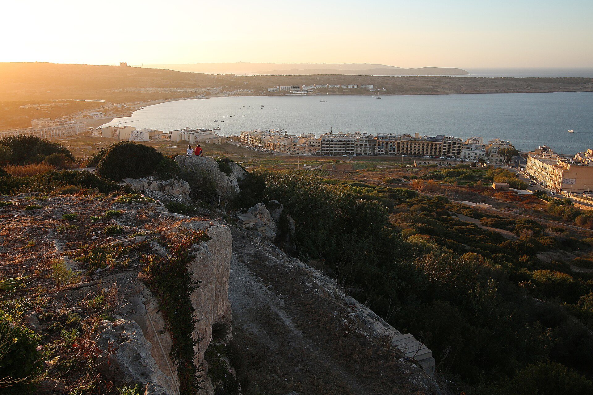The long sandy sweep of Mellieħa Bay seen from the hillside above it